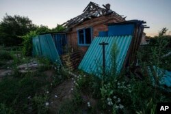 A house damaged from shelling is seen in Kramatorsk, eastern Ukraine, July 18, 2022.