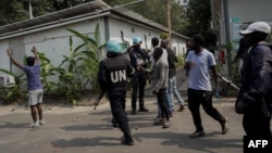 Congolese protesters are seen inside the United Nations Mission for the Stabilisation of Congo (MONUSCO) Headquarters in Goma, DRC, July 25, 2022. 