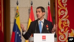 FILE - The leader of Venezuela's political opposition Juan Guaido makes a speech at the Madrid regional government building during a visit to Madrid, Spain, Jan. 25, 2020. 