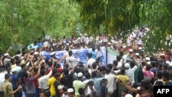 Rohingya refugees walk a 'Go home campaign' rally demanding repatriation at Kutupalong Rohingya camp in Cox's Bazar on June 19, 2022.