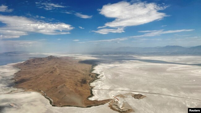 Dry land surrounds Antelope Island where there used to be water in the Great Salt Lake, in Salt Lake City, Utah, U.S., July 13, 2022. (REUTERS/Brian Snyder)