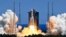 FILE: In this photo released by Xinhua News Agency, the Long March 5B Y3 carrier rocket, carrying Wentian lab module blasts off from the Wenchang Space Launch Center in southern China's Hainan Province, July 24, 2022.