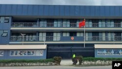 FILE - The Chinese national flag flies outside the Chinese Embassy in Honiara, Solomon Islands, April 1, 2022.