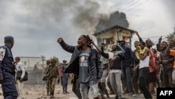FILE: Congolese demonstrators protest against the UN peacekeeping mission MONUSCO in Goma on July 26, 2022. Anger has been fuelled by perceptions that MONUSCO, the UN mission in the Democratic Republic of Congo (DRC), is failing to do enough to stop attacks by armed groups. 