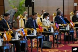 Cambodian Foreign Minister Prak Sokhonn, second right, delivers an opening speech during ASEAN Foreign Ministers Interface Meeting with ASEAN Intergovernmental Commission on Human Rights (AICHR) representatives in Phnom Penh, Cambodia, Tuesday, Aug. 2, 2022.