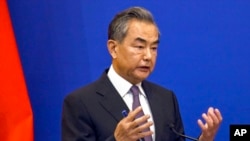 FILE - Chinese Foreign Minister Wang Yi speaks at a press conference at the Pacific Islands Foreign Ministers meeting in Suva, Fiji, May 30, 2022.