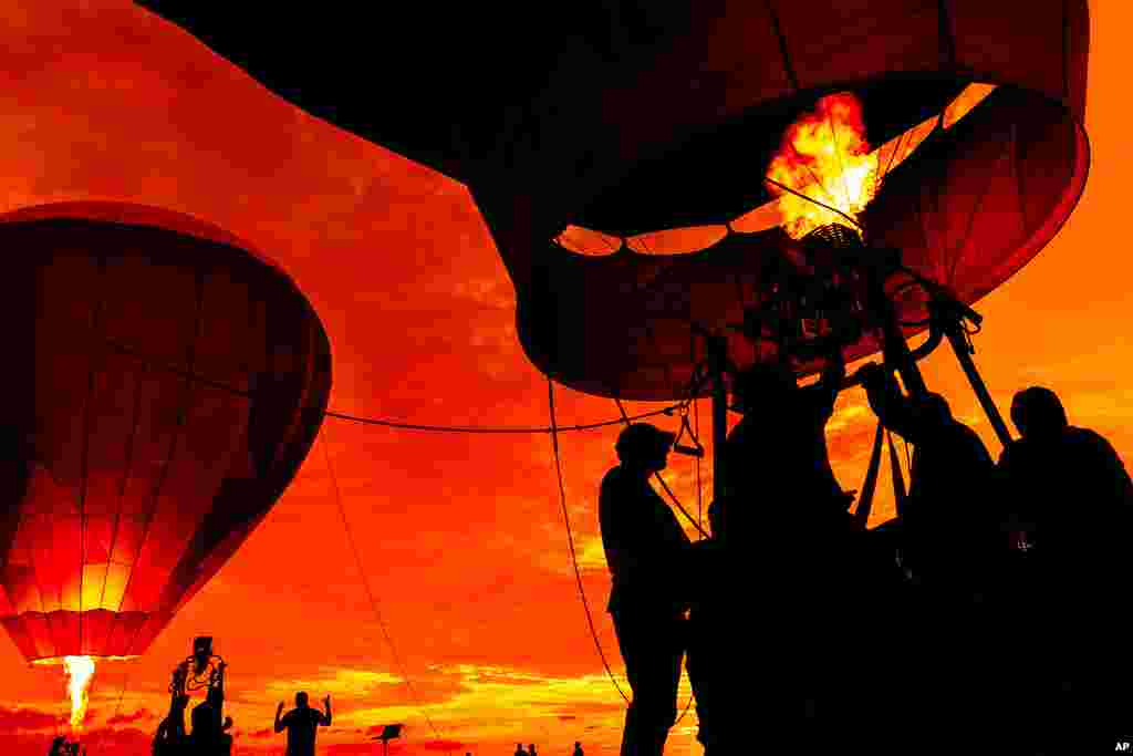 Crews inflate hot air balloons during the 39th annual New Jersey Lottery Festival of Ballooning at Solberg Airport, in Readington, N.J. 