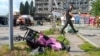 FILE - A baby stroller lies by a road after a deadly Russian missile attack in Vinnytsia, Ukraine, July 14, 2022. At least 20 people, including three children, were killed in the attack.