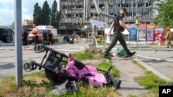 FILE - A baby stroller lies by a road after a deadly Russian missile attack in Vinnytsia, Ukraine, July 14, 2022. At least 20 people, including three children, were killed in the attack.