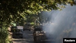 A Ukrainian tank drives not far from front line, in the Donbas region, Ukraine, July 17, 2022.