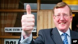 FILE - David Trimble leaves a polling station in Lisburn, Northern Ireland, May 5, 2005, after voting in Northern Ireland's election. Trimble, a former Northern Ireland first minister and key architect of the Good Friday Agreement that ended decades of conflict, died at age 77. 