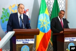 FILE - Russian Foreign Minister Sergey Lavrov, left, and Ethiopia's Deputy Prime Minister and Minister of Foreign Affairs Demeke Mekonnen Hassen attend a joint news conference after their talks, in Addis Ababa, Ethiopia, July 27, 2022. (Russian Foreign Ministry Press Service via AP)