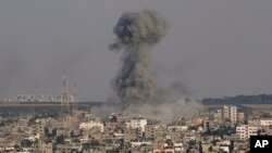 Smoke rises following Israeli airstrikes on a building in Gaza City's Shijaiyah neighborhood, Aug. 7, 2022.