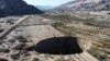 A sinkhole that emerged last week has doubled in size, at a mining zone close to Tierra Amarilla town, in Copiapo, Chile, Aug. 7, 2022.