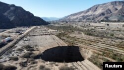 A sinkhole that emerged last week has doubled in size, at a mining zone close to Tierra Amarilla town, in Copiapo, Chile, Aug. 7, 2022.