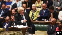 A handout photograph released by the U.K. Parliament shows Britain's Prime Minister Boris Johnson speaking during his final Prime Minister's Questions at the House of Commons in London on July 20, 2022.