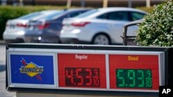 FILE - Gas prices are displayed at a Sunoco station along the Ohio Turnpike near Youngstown, Ohio. Taken 7.12.2022