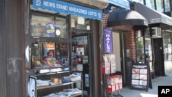 FILE - Various local newspapers appear outside a convenience store in Brooklyn, New York, on June 30, 2022. As newspapers struggle financially, they lack resources to fight for access or defend themselves in court.