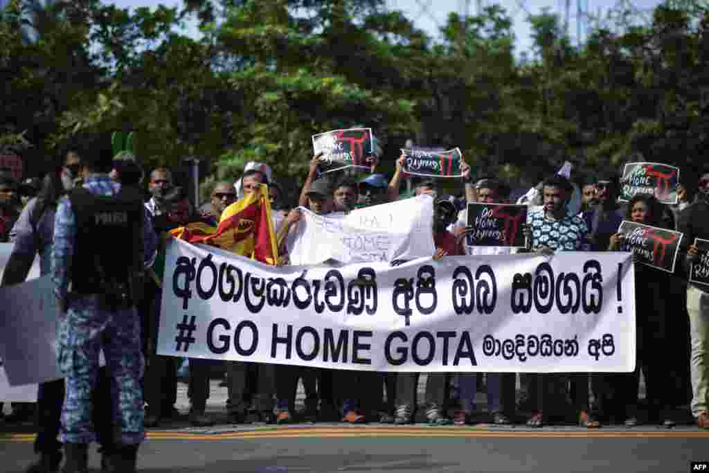 Sri Lankans living in the Maldives stage a demonstration in Male, July 13, 2022, to protest for the arrival of former President Gotabaya Rajapaksa who is fleeing his own country.