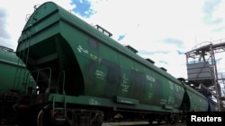 FILE - Railway cars for grain are pictured at a grain terminal, in Odesa Region, June 22, 2022.