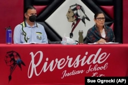 Assistant Secretary for Indian Affairs Bryan Newland, left, and Interior Secretary Deb Haaland, right, in Anadarko, Oklahoma, July 9, 2022.