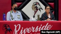 Assistant Secretary for Indian Affairs Bryan Newland, left, and Interior Secretary Deb Haaland, right, in Anadarko, Oklahoma, July 9, 2022. 