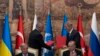 Turkish President Recep Tayyip Erdogan, right, and U.N. Secretary General Antonio Guterres lead a signing ceremony at Dolmabahce Palace in Istanbul, Turkey, Friday, July 22, 2022.