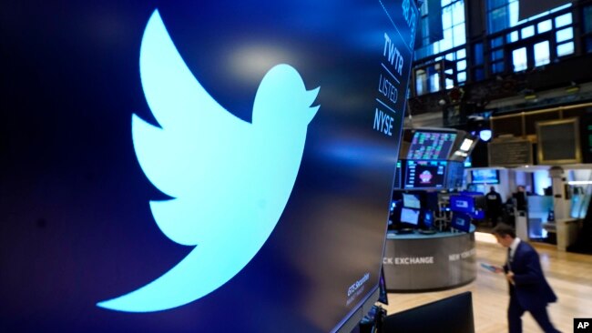 The logo for Twitter appears above a trading post on the floor of the New York Stock Exchange in this Nov. 29, 2021, file photo. 