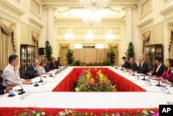 In this photo provided by Ministry of Communications and Information, Singapore, U.S. House Speaker Nancy Pelosi, fourth from left, and Prime Minister Lee Hsien Loong, fourth from right, meet at the Istana Presidential Palace in Singapore, Monday, Aug. 1,