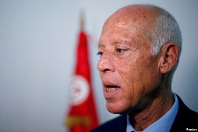 FILE PHOTO: Presidential candidate Kais Saied speaks during an interview with Reuters.