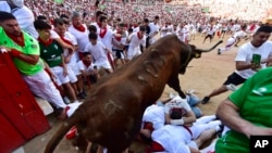 FILE: Representative image of a fighting bull jumping over runners entering the bullring during the running of the bulls at the San Fermin Festival in Pamplona, northern Spain.