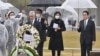 File - Japanese Prime Minister Fumio Kishida and U.S. Ambassador Rahm Emanuel visit Hiroshima's Peace Memorial Park in Hiroshima, March 26, 2022.