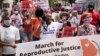 FILE - Protesters participate in the March for Reproductive Justice on Oct. 2, 2021, in downtown Atlanta.