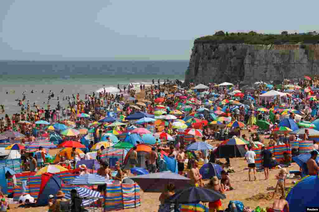 A general view shows beach-goers spending a hot summer day at Joss Bay in Broadstairs, Britain.