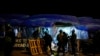 Army soldiers remove the anti-government banners from the site of a protest camp outside the Presidential Secretariat in Colombo, Sri Lanka, July 22, 2022.