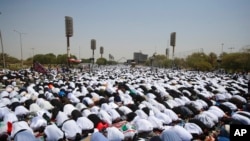 Followers of Shiite cleric Muqtada al-Sadr attend open-air Friday prayers at Grand Festivities Square within the Green Zone, in Baghdad, Iraq, Aug. 5, 2022.
