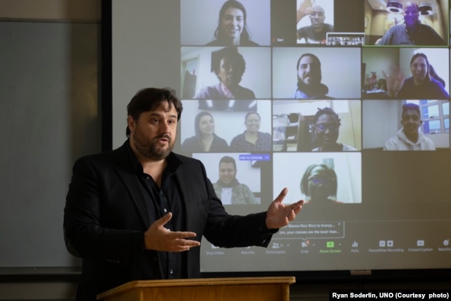 FILE - Jonathan Santo teaches adolescent development, statistics, and cross-cultural psychology at the University of Nebraska at Omaha. Santo is seen here on Aug. 2, 2020, at UNO.