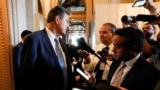 U.S. Senator Joe Manchin (D-WV) speaks with reporters after walking off the Senate floor during voting for the "Inflation Reduction Act of 2022," at the U.S. Capitol building in Washington, Aug. 7, 2022. 