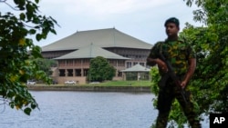 An army soldier soldier stands guard outside the parliament building in Colombo, Sri Lanka, July 16, 2022.