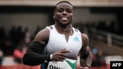 FILE: Kenya's Ferdinand Omanyala, the 100-meter African record holder, reacts after winning the men's 100m final during the national trials for the World Championships and the Commonwealth Games at the Kasarani stadium in Nairobi, Kenya, on June 25, 2022. 