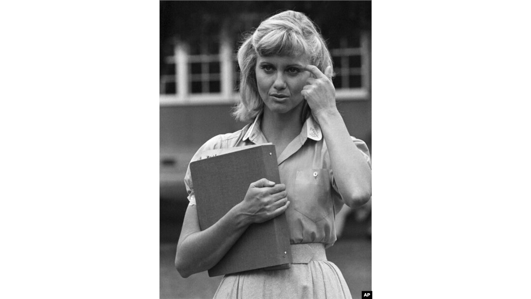 FILE - Olivia Newton-John readies herself for her role in the movie version of "Grease," in Los Angeles, Aug. 30, 1977.