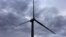 FILE - A worker stands atop a wind turbine during a routine inspection at the Infigen Energy wind farm located on the hills surrounding Lake George, 50 km north of the Australian capital city of Canberra, May 13, 2013.