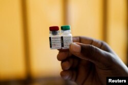 FILE - A nurse holds malaria vaccine vials at the Lumumba Sub-County hospital in Kisumu, Kenya, July 1, 2022. (REUTERS/Baz Ratner/File Photo)