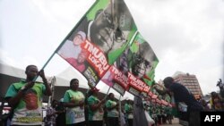 FILE - Supporters of the All Progressive Congress' Bola Ahmed Tinubu celebrate after the party announces him as the winner of its presidential primary at Eagle Square in Abuja, Nigeria, June 8, 2022.