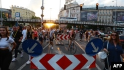 People take part in a rally under the motto "Stand for Victims of Orban's Government" against the new taxation rules in Budapest, Hungary, July 16, 2022.