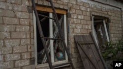 Damages inside a home, in the aftermath of a Russian rocket attack, on the outskirts of Pokrovsk, eastern Ukraine, July 16, 2022. 