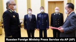 Russian Ambassador to North Korea Alexander Matsegora, pictured at left during a ceremony on May 5, 2020, said in an interview with a Russian newspaper that Moscow could hire North Korean workers to rebuild Ukraine's war-ruined Donbas region, now largely under Russian control.