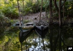 Small boats sit idle on the banks of the Tapajos river in Alter do Chao Para state, Brazil, Aug. 26, 2020. (AP Photo/Andre Penner, File)