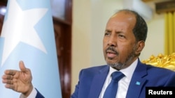FILE - Somalia's President Hassan Sheikh Mohamud speaks during a Reuters interview in Mogadishu, Somalia, May 28, 2022. On Tuesday, he called for a cease-fire after clashes in a disputed town in the breakaway region of Somaliland left at least 13 people dead.