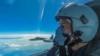 In this photo released by Xinhua News Agency, a Chinese air force pilot conducts a combat training exercises around the Taiwan Island, Aug. 7, 2022.